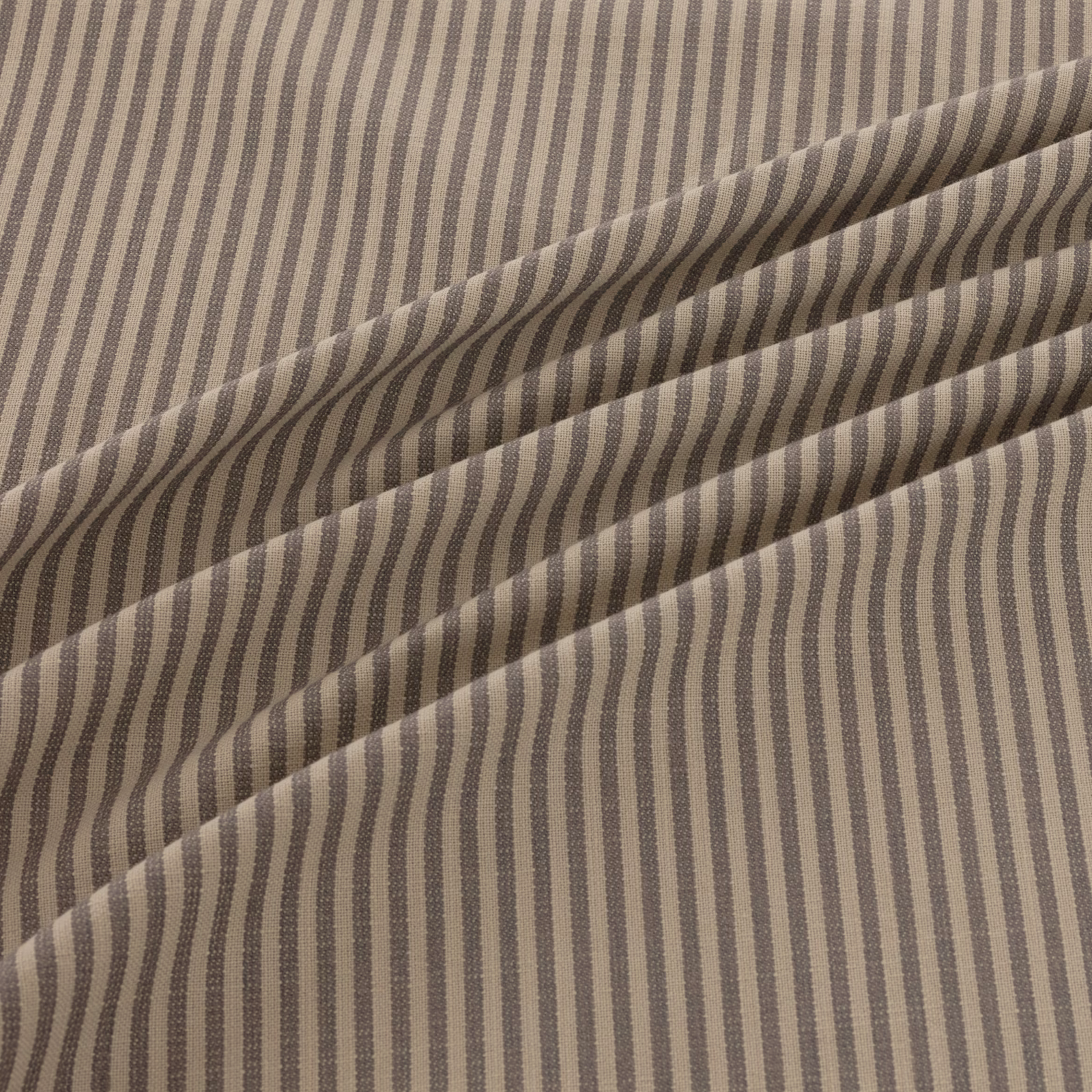 Taupe and charcoal irregular stripes in a softly folded woven textile