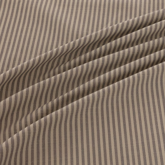 Taupe and charcoal irregular stripes in a softly folded woven textile