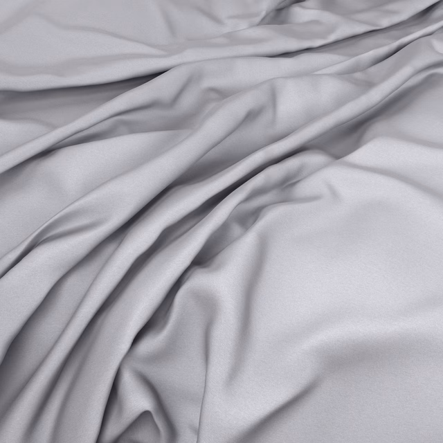 Pale magnesium-grey fabric gathered into smooth, softly lustrous fluid folds