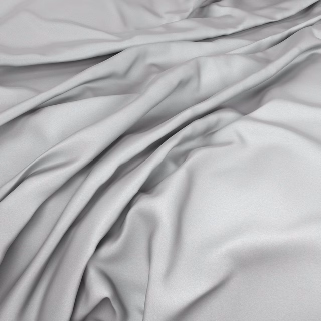 Pale mist-grey fabric with a smooth softly lustrous surface gathered into fluid folds