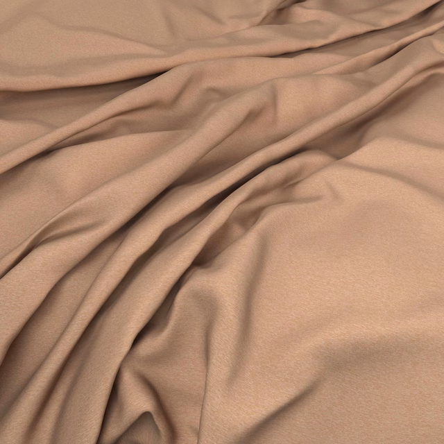 Muted pumpkin-terracotta fabric falling in soft folds with a subtle surface sheen