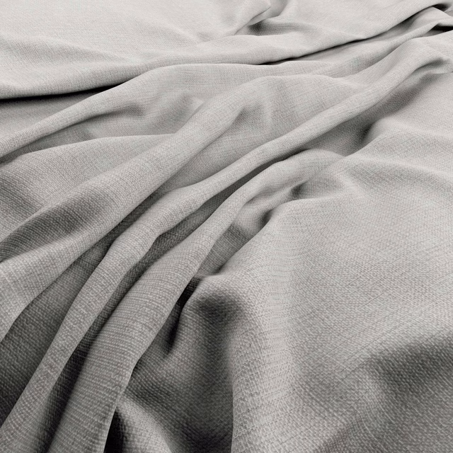 Close view of pale smoke-grey fabric with fine weave and fluid layered folds