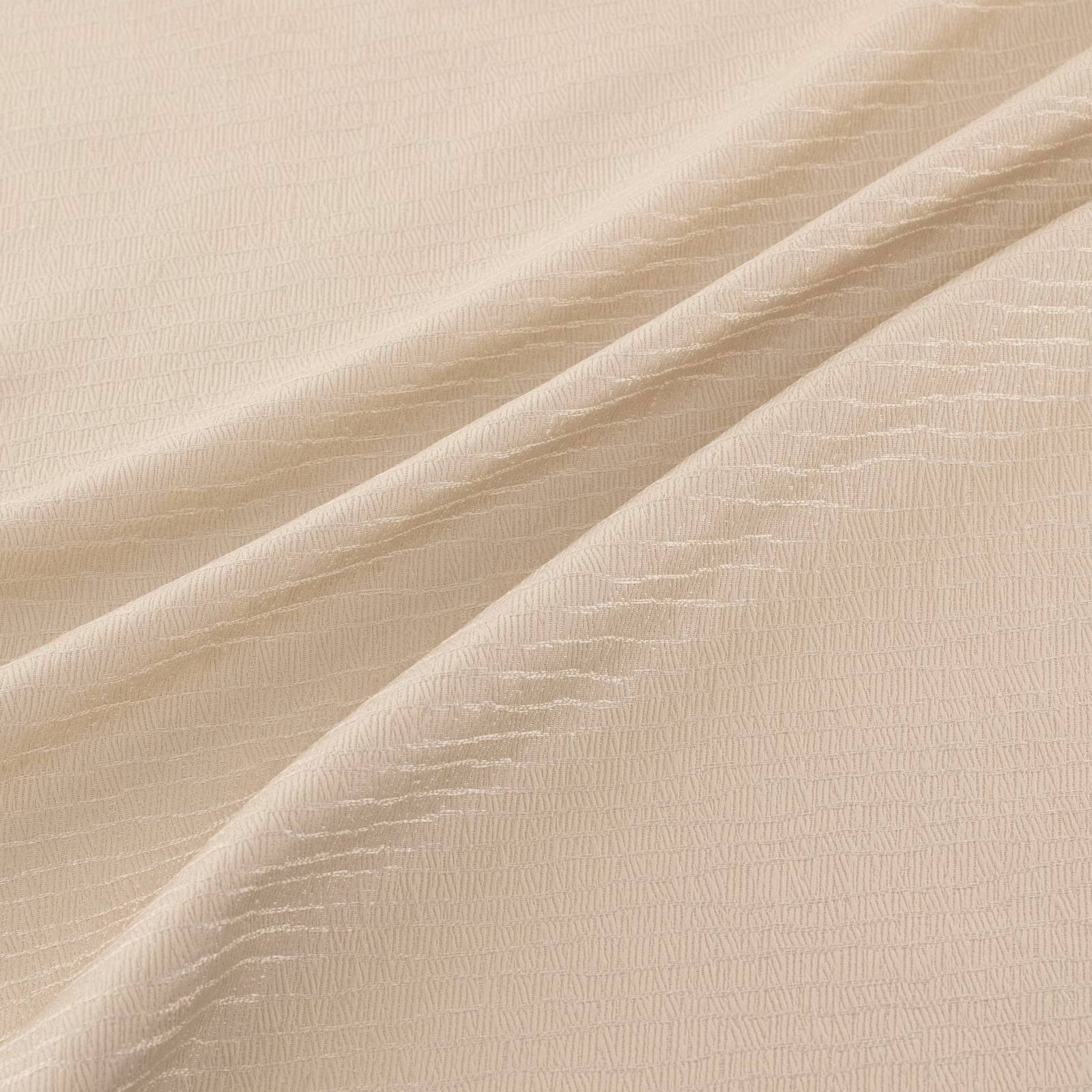 Pale champagne-gold fabric with fine rippled weave draped in soft diagonal folds