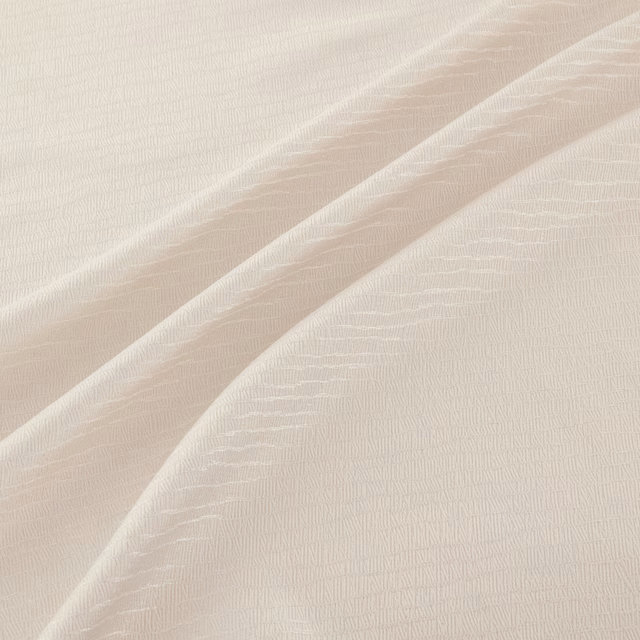 Warm ivory textile with fine irregular linear texture falling in soft diagonal folds