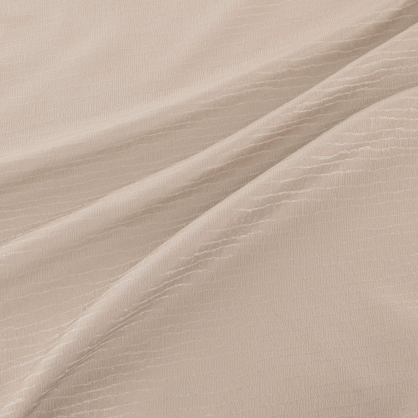 Pale quartz-taupe fabric with fine rippled lines falling in soft fluid folds
