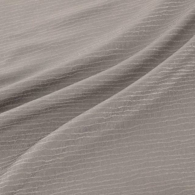 Cool silver-grey fabric with fine rippled lines and diagonal shaded folds