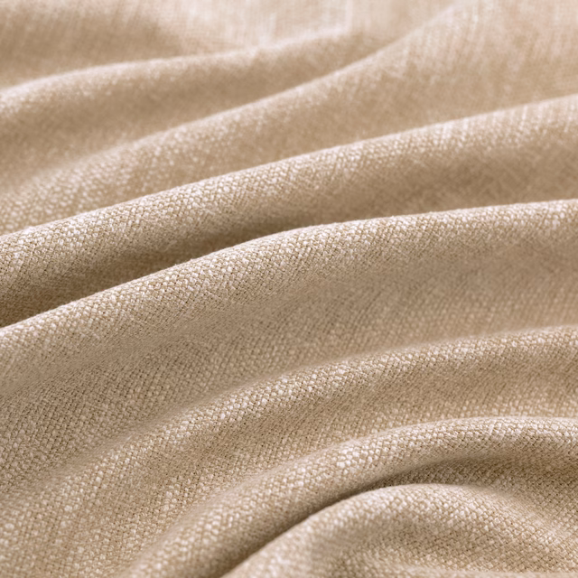 Warm flax-beige woven textile draped in soft folds with fine crosshatch texture