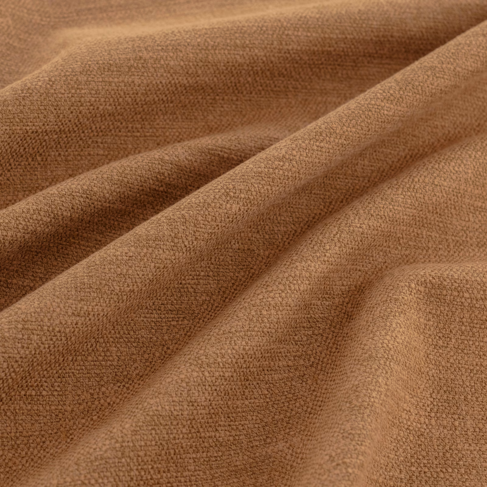 Warm hickory-brown fabric with a fine nubby weave folded into soft draped ridges