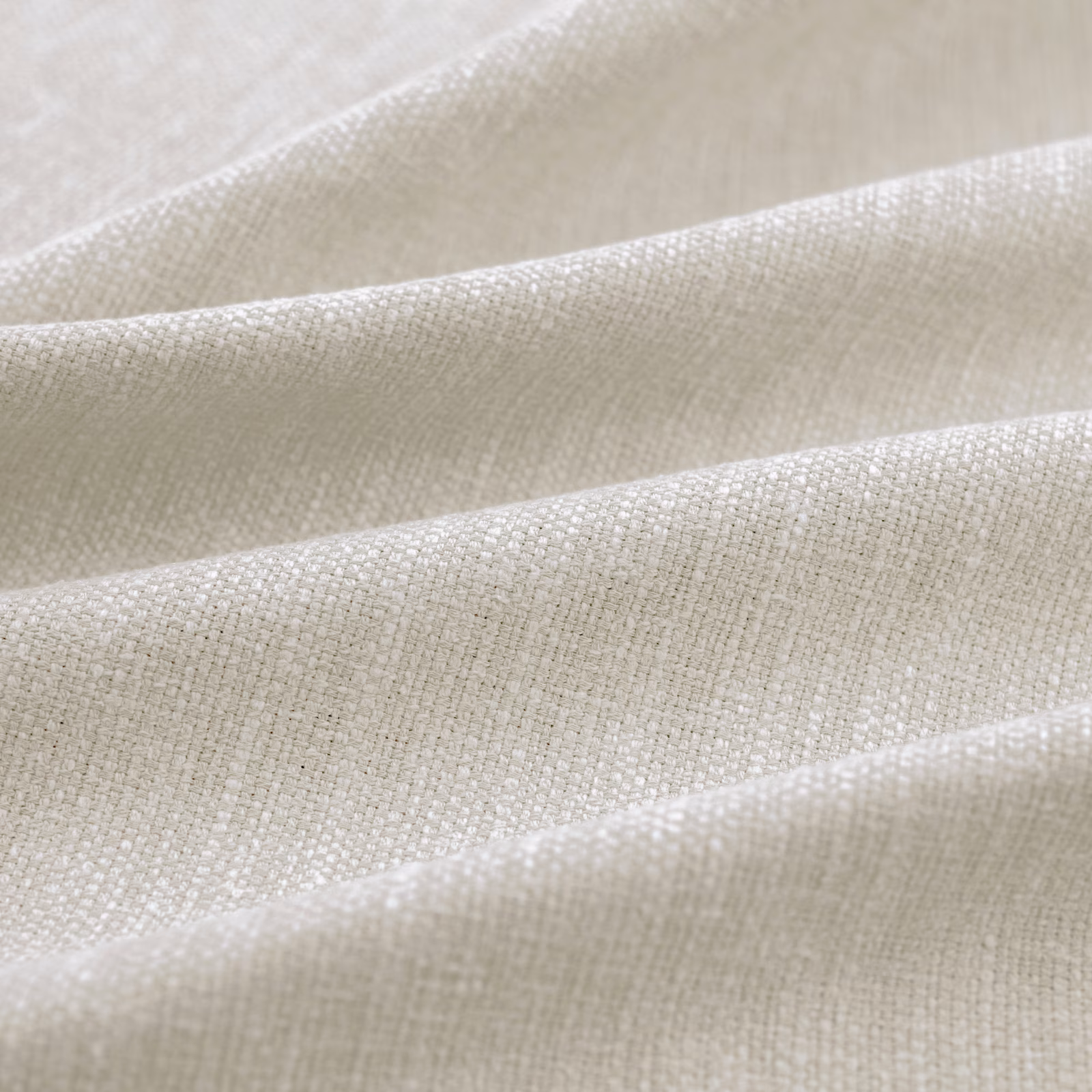 Pale greige woven Slite Marble fabric with a fine crosshatched texture in folds