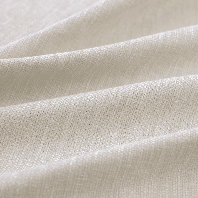 Pale greige woven Slite Marble fabric with a fine crosshatched texture in folds