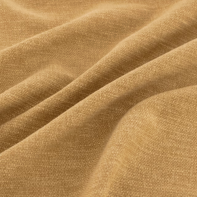 Warm ochre woven fabric with fine grain and softly shaded folded ridges
