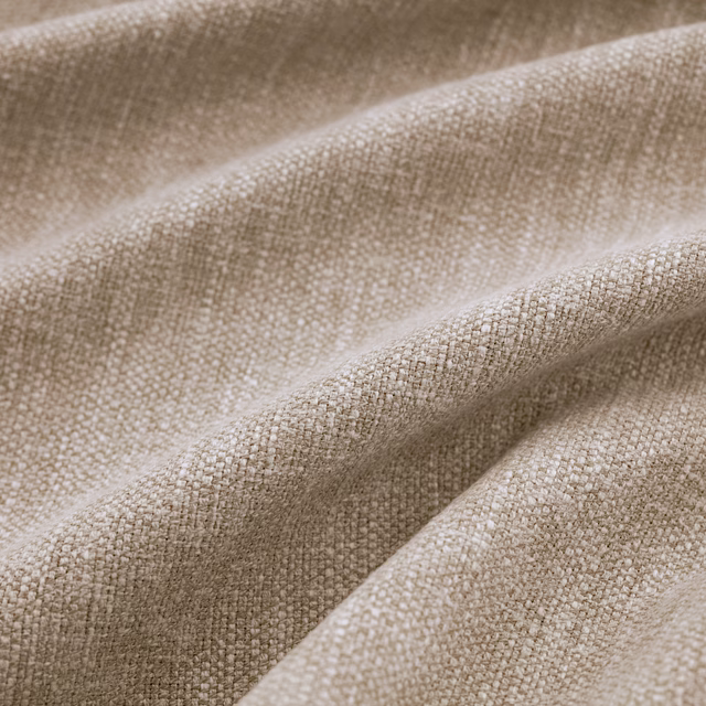 Close-up of Slite Pumice’s softly nubby greige plain weave in folded drapes