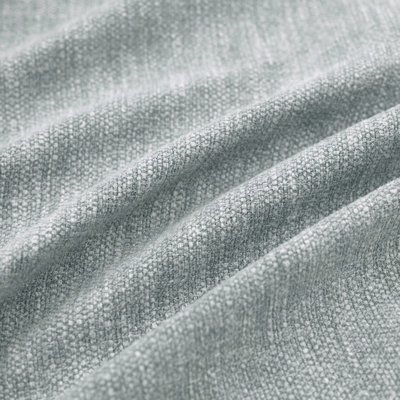 Cool seaglass grey-green woven fabric with fine pebble texture in soft folds