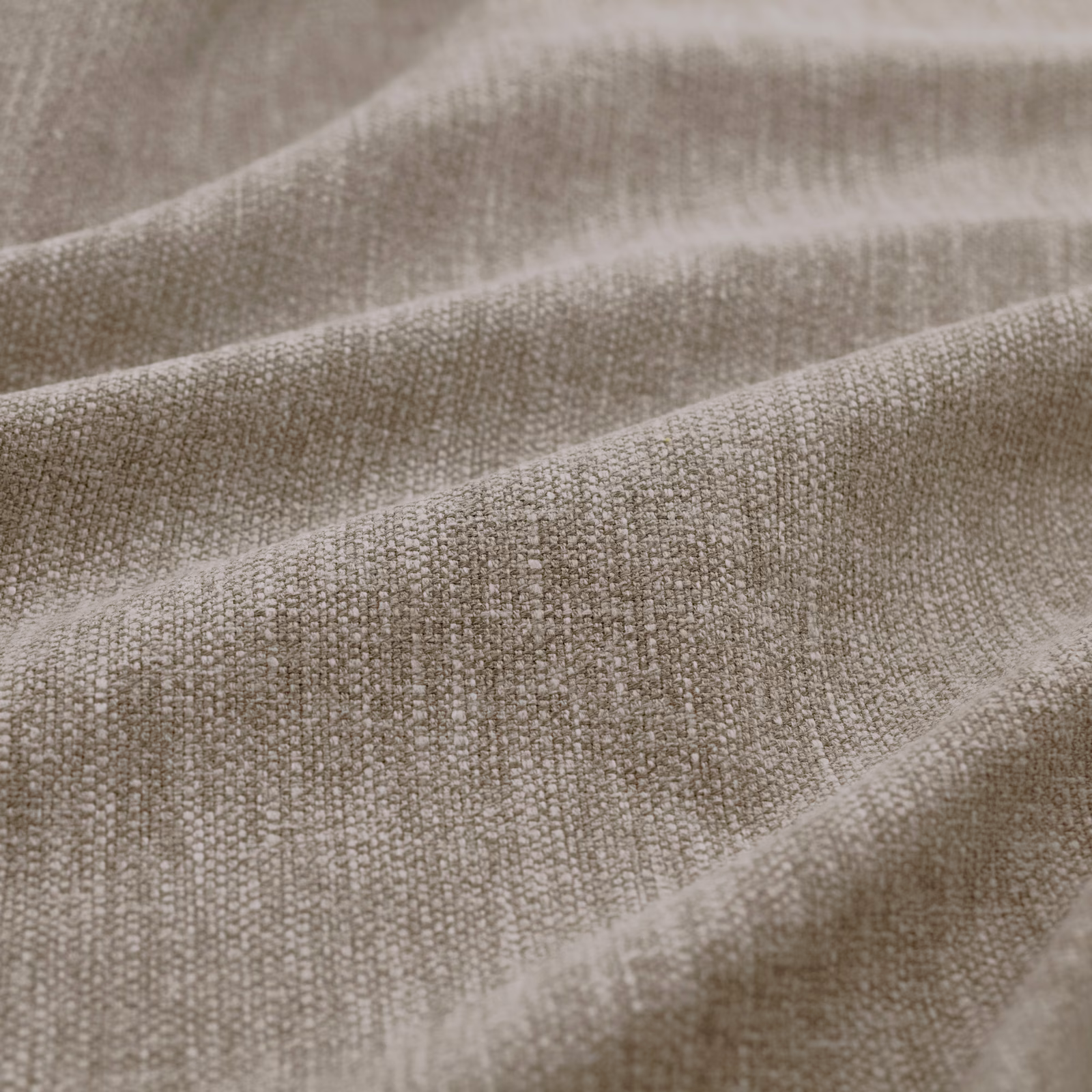 Close-up of taupe-grey Slite Shadow fabric showing a small irregular woven texture in soft folds