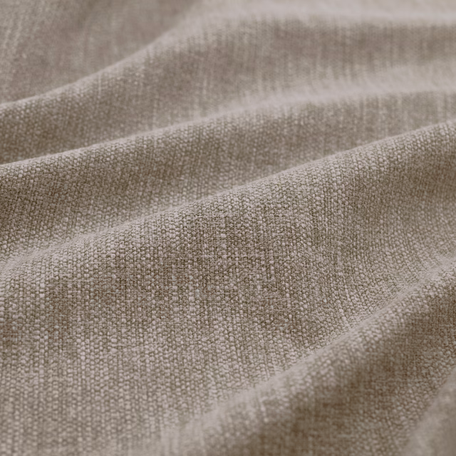 Close-up of taupe-grey Slite Shadow fabric showing a small irregular woven texture in soft folds
