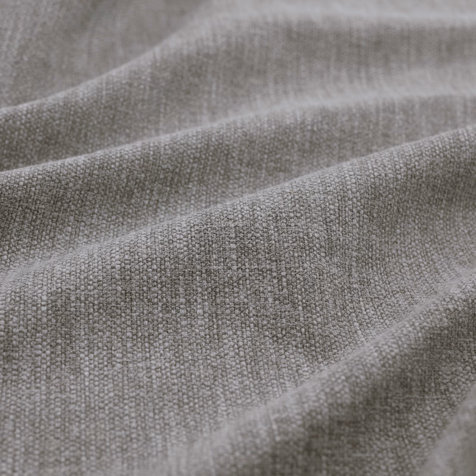 Cool storm-grey woven fabric showing fine flecks and softly folded texture