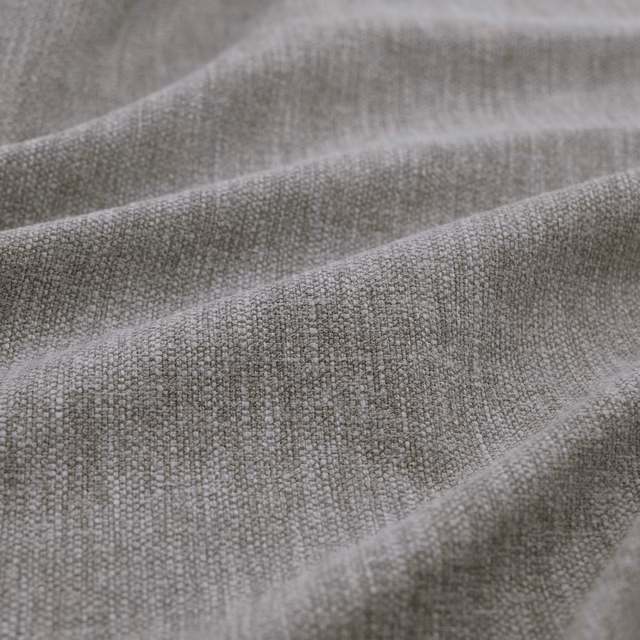 Cool storm-grey woven fabric showing fine flecks and softly folded texture