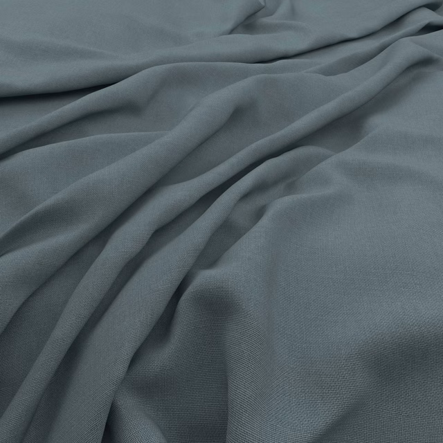 Muted airforce blue-grey slubby weave gathered into soft, fluid fabric folds