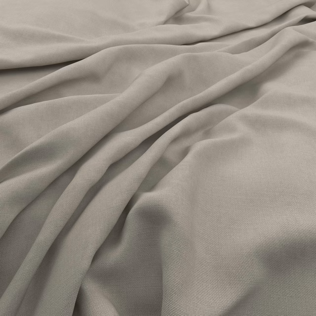 Warm stone-grey woven fabric with subtle slubs gathered into soft sculptural folds
