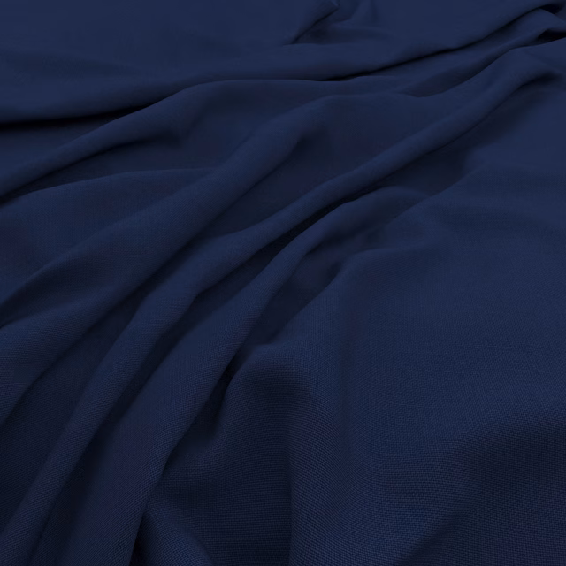 Deep navy fabric with subtle slub texture and softly gathered fluid folds