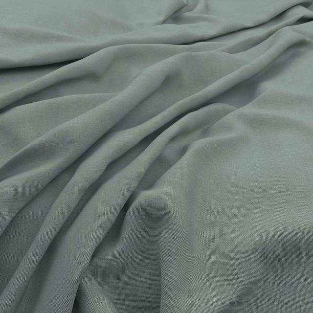 Muted seaglass blue-green fabric with fine woven texture and soft folds