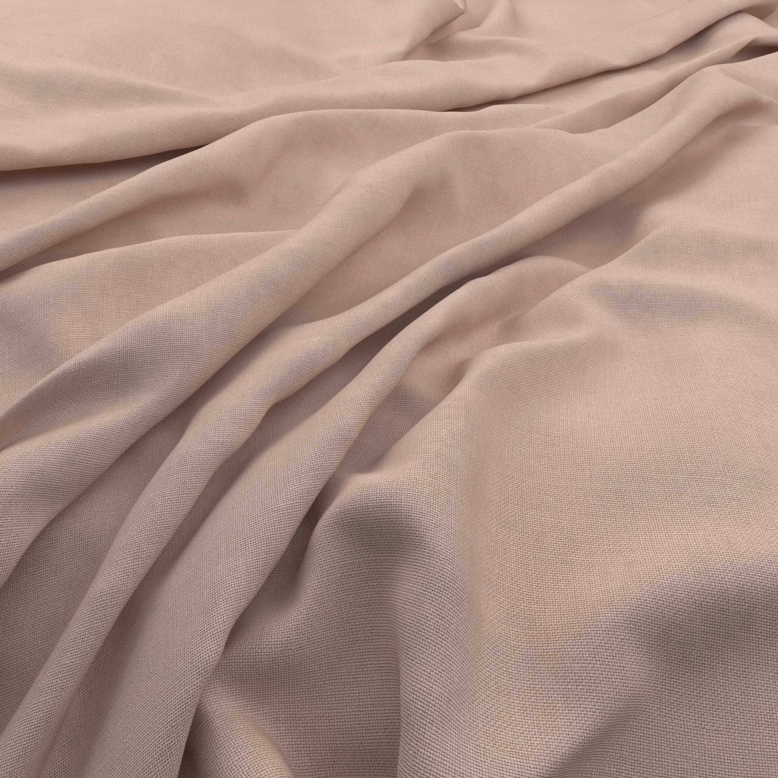 Soft shell pink slubby weave shown in flowing folds with subtle dusty rose shadows