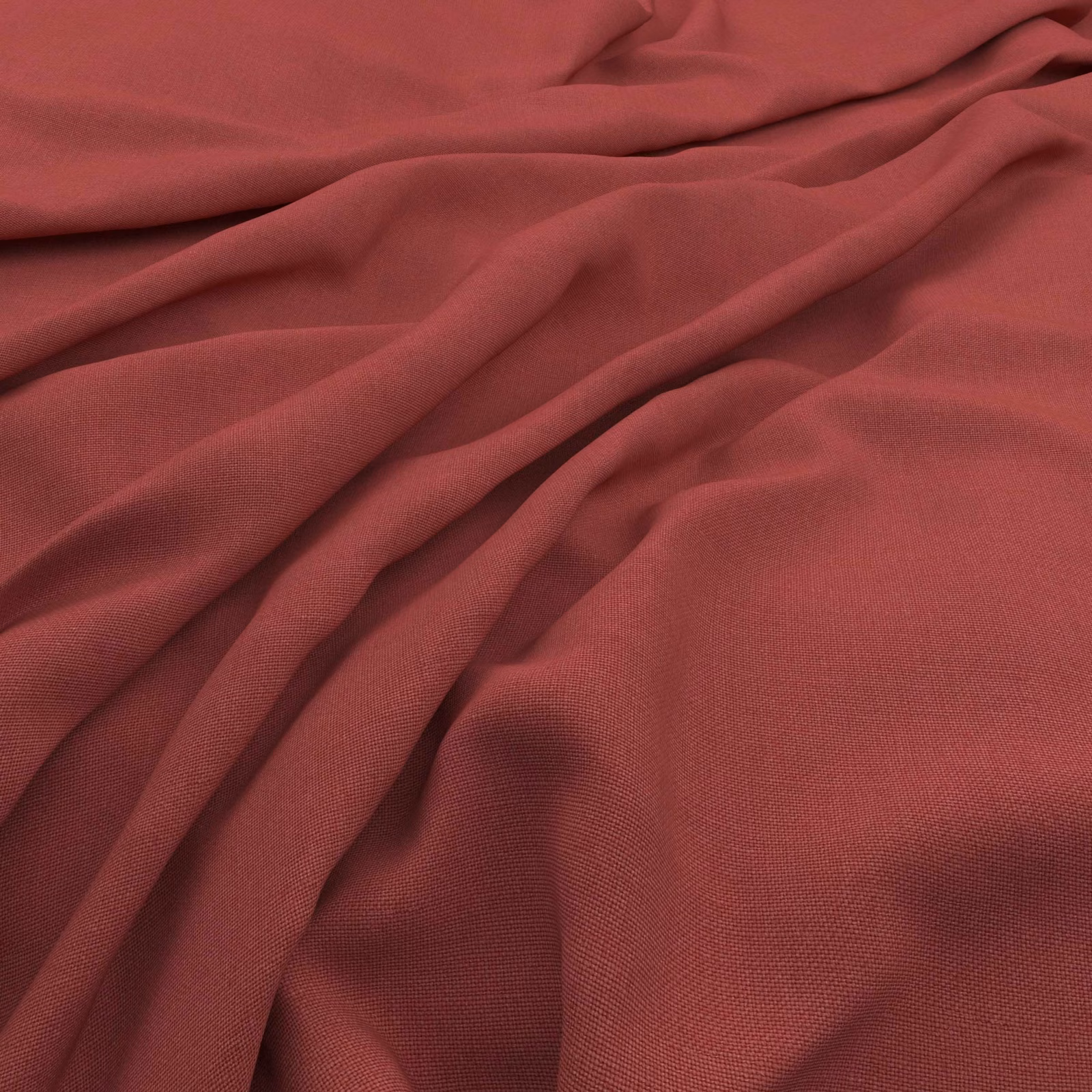 Draped muted vintage red fabric showing fine woven texture and shaded folds
