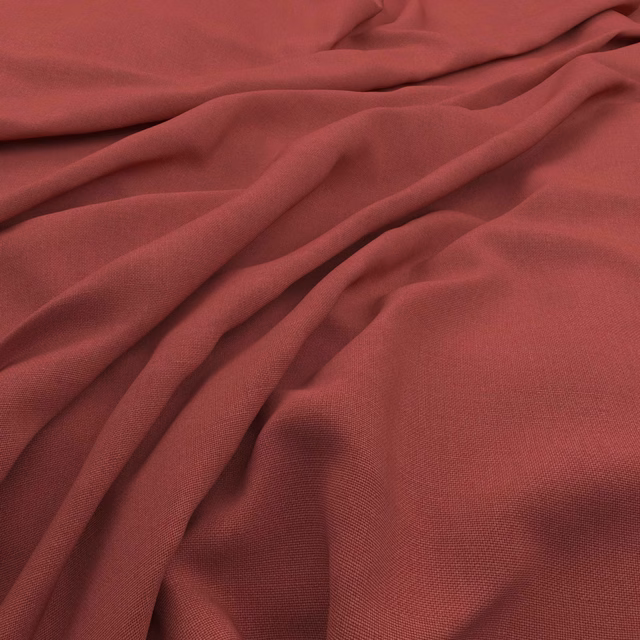 Draped muted vintage red fabric showing fine woven texture and shaded folds