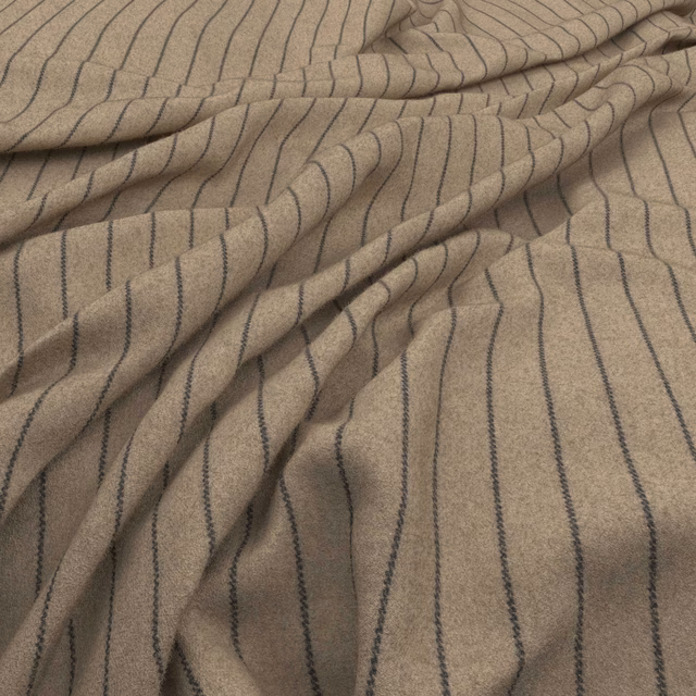 Taupe woven textile with narrow navy irregular stripes, softly gathered to show texture