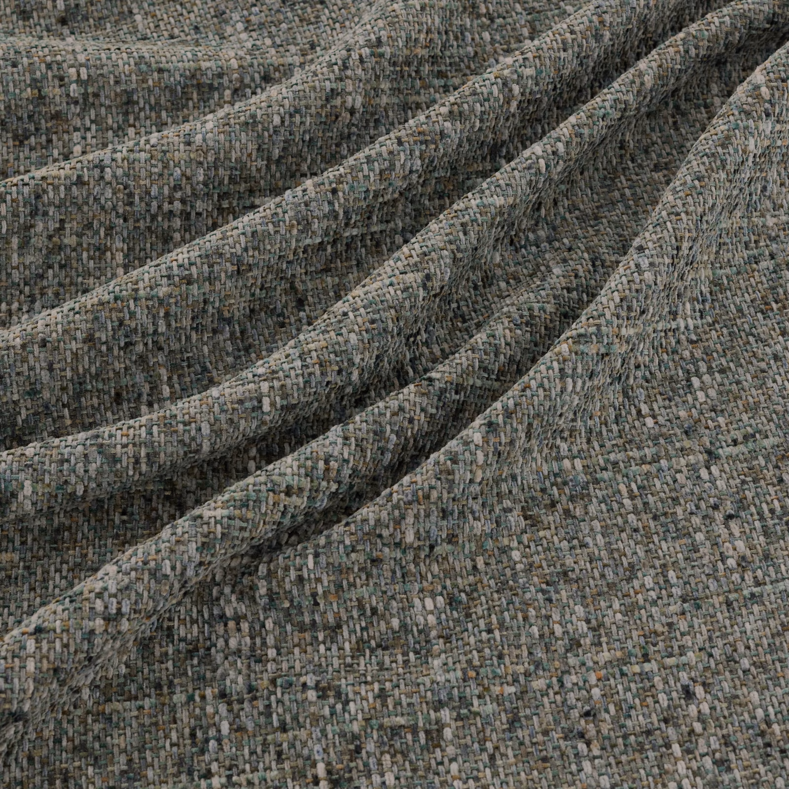 Mottled blue-grey woven textile with a small-scale nubby texture in soft folds