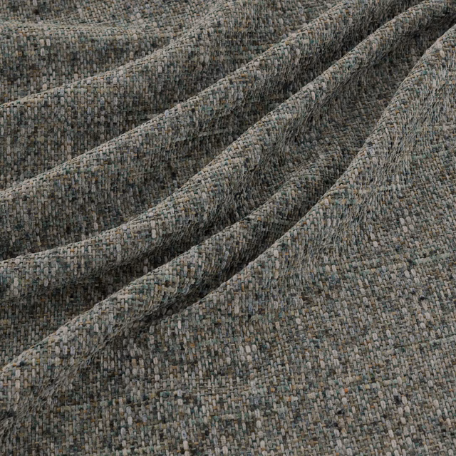 Mottled blue-grey woven textile with a small-scale nubby texture in soft folds