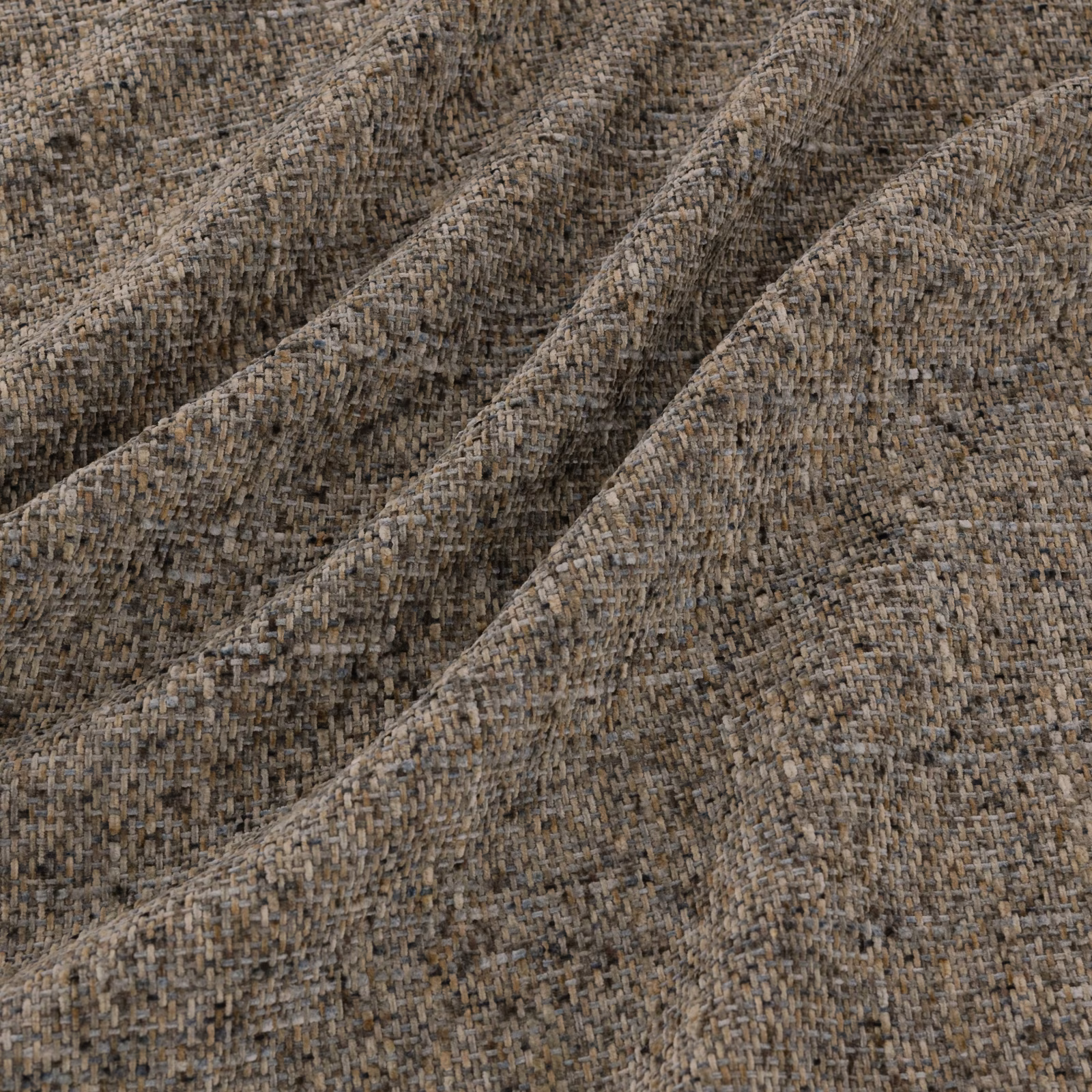 Close-up of Soho Fossil's mottled taupe-brown chunky woven textile with raised tonal threads
