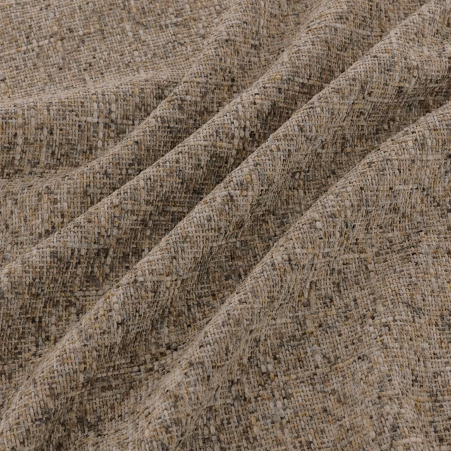 Warm taupe woven upholstery textile with oatmeal, grey and brown flecking in folded ridges