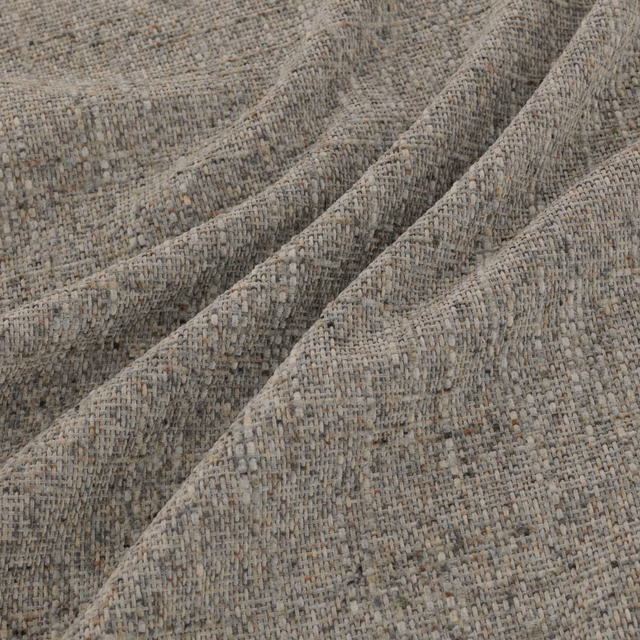 Close view of grey-taupe Soho Smoke with a chunky flecked woven texture