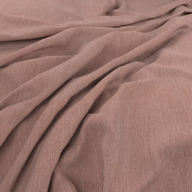 Dusty rose fabric with softly irregular weave falling into fluid folds