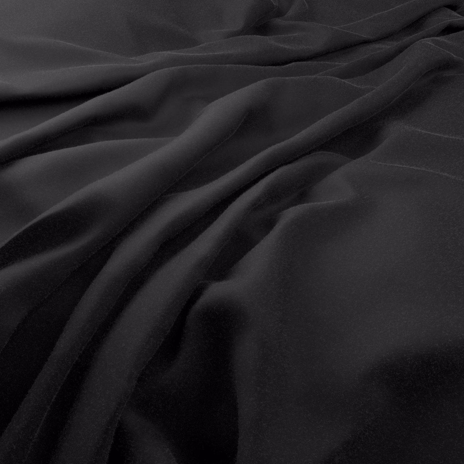 Deep black Solaire fabric cascading in smooth, softly highlighted folds
