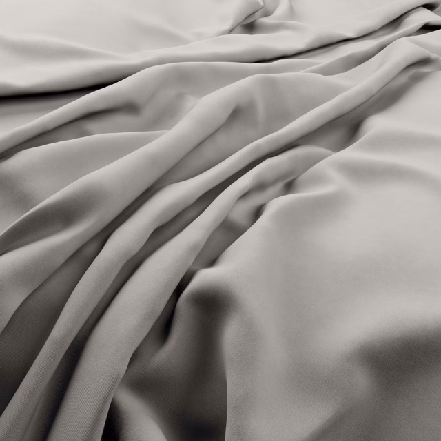 Pale cool-grey plain fabric gathered in smooth, softly lustrous folds