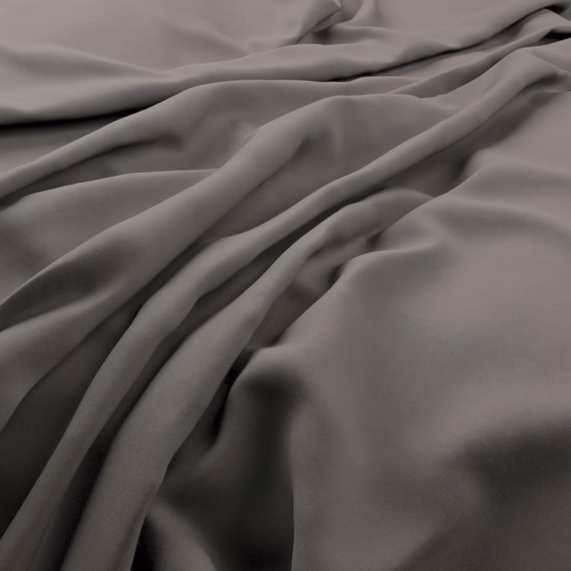 Dolphin-grey fabric falling in soft, fluid folds with a muted sheen