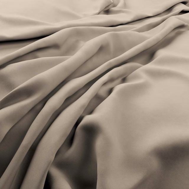 Warm taupe-beige plain fabric falling in soft, satin-like folds