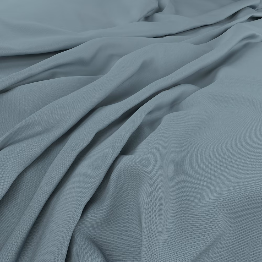 Muted blue-grey fabric falling in soft folds with a fine, smooth weave
