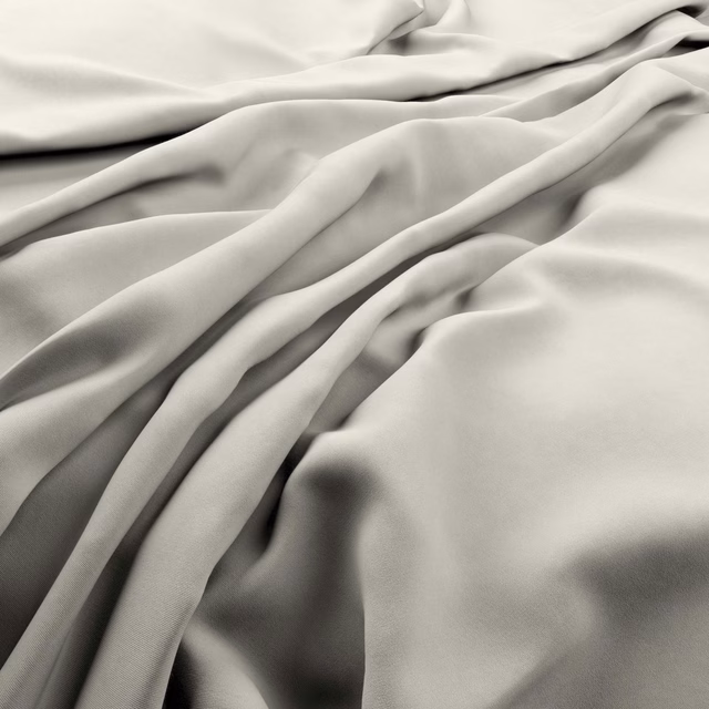 Fluid ivory-grey fabric in smooth draped folds with soft satin-like highlights