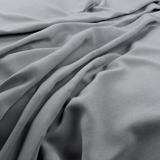 Soft silver-grey fabric with subtle linear grain falling into fluid gathered folds