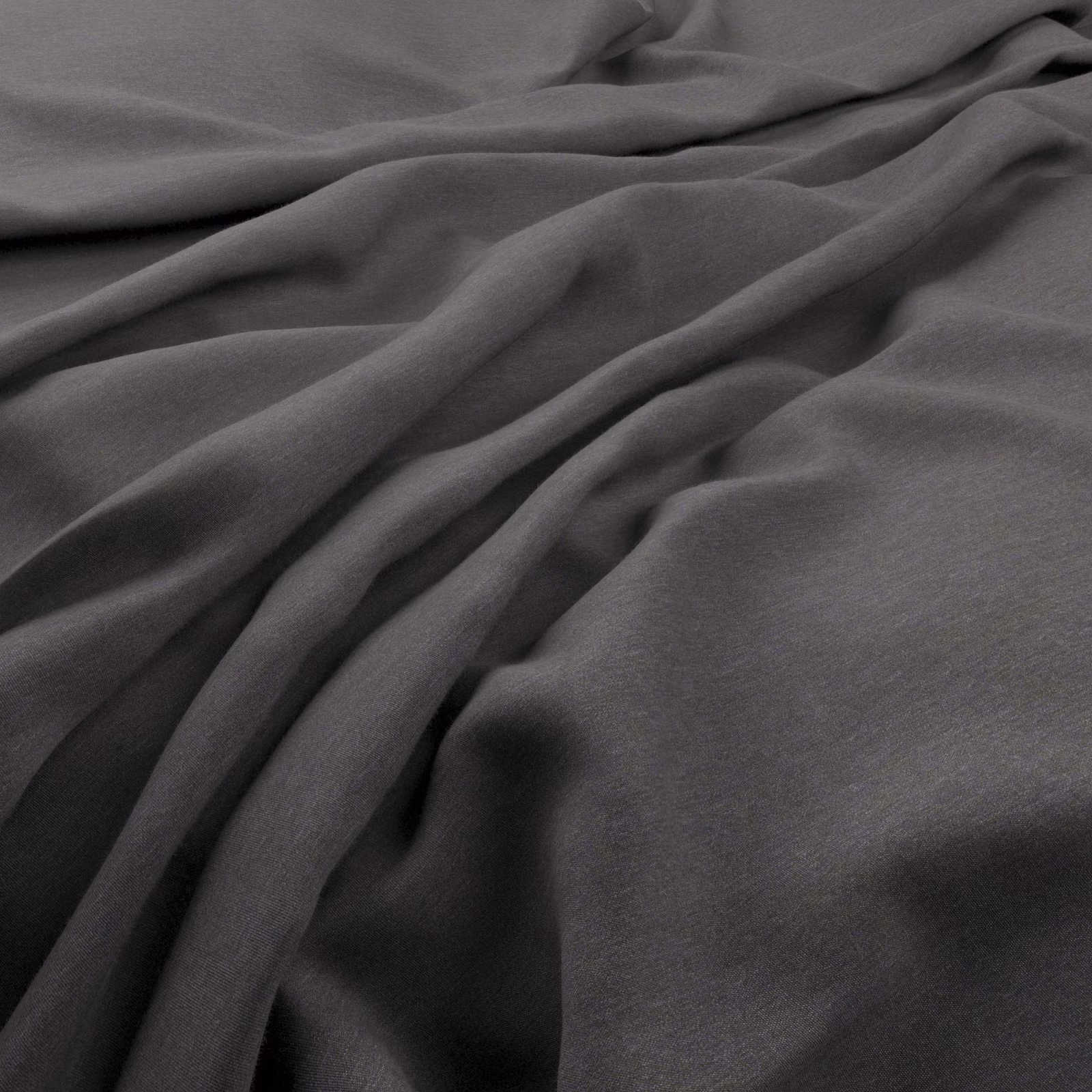 Slate-grey Solaire fabric draped in fluid folds with a fine, softly textured surface