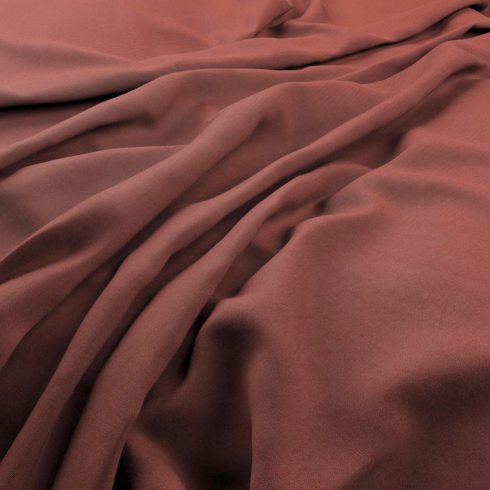 Muted watermelon red fabric draped in smooth, fluid folds with berry-toned shadows