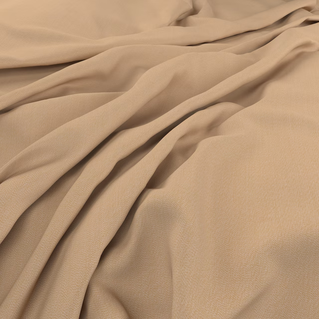 Warm wheat-beige fine weave falling in soft, fluid folds