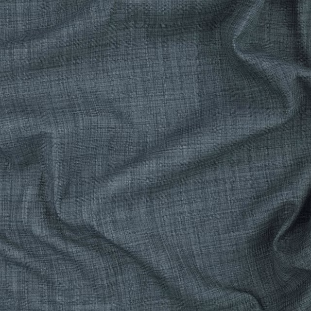 Deep blue-grey teal fabric with fine crosshatch weave gathered into soft folds