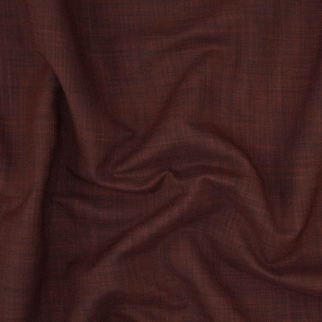 Dark burgundy woven cloth with fine crosshatch texture gathered into soft folds