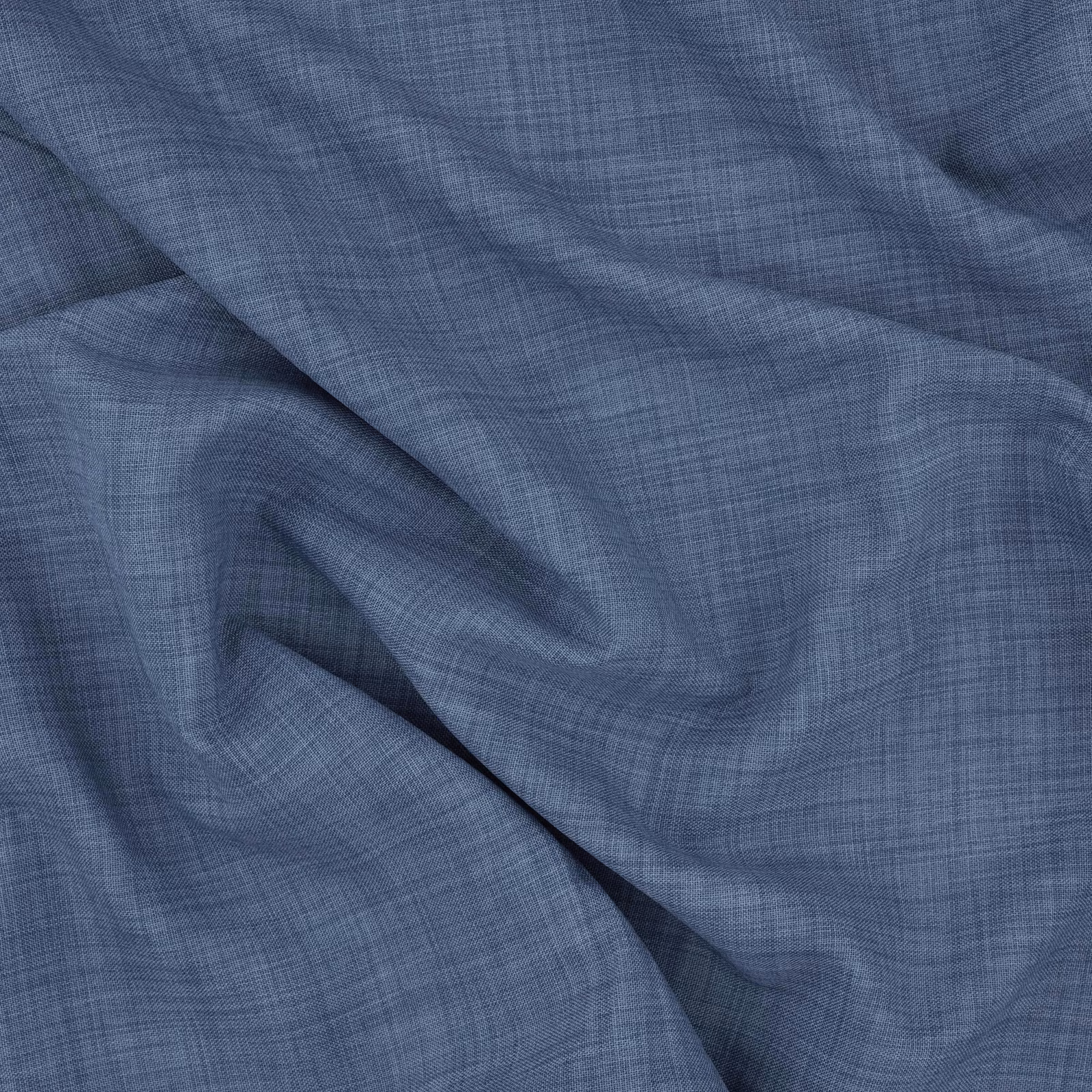 Muted cobalt-blue fabric with a fine crosshatched weave folded into soft ripples