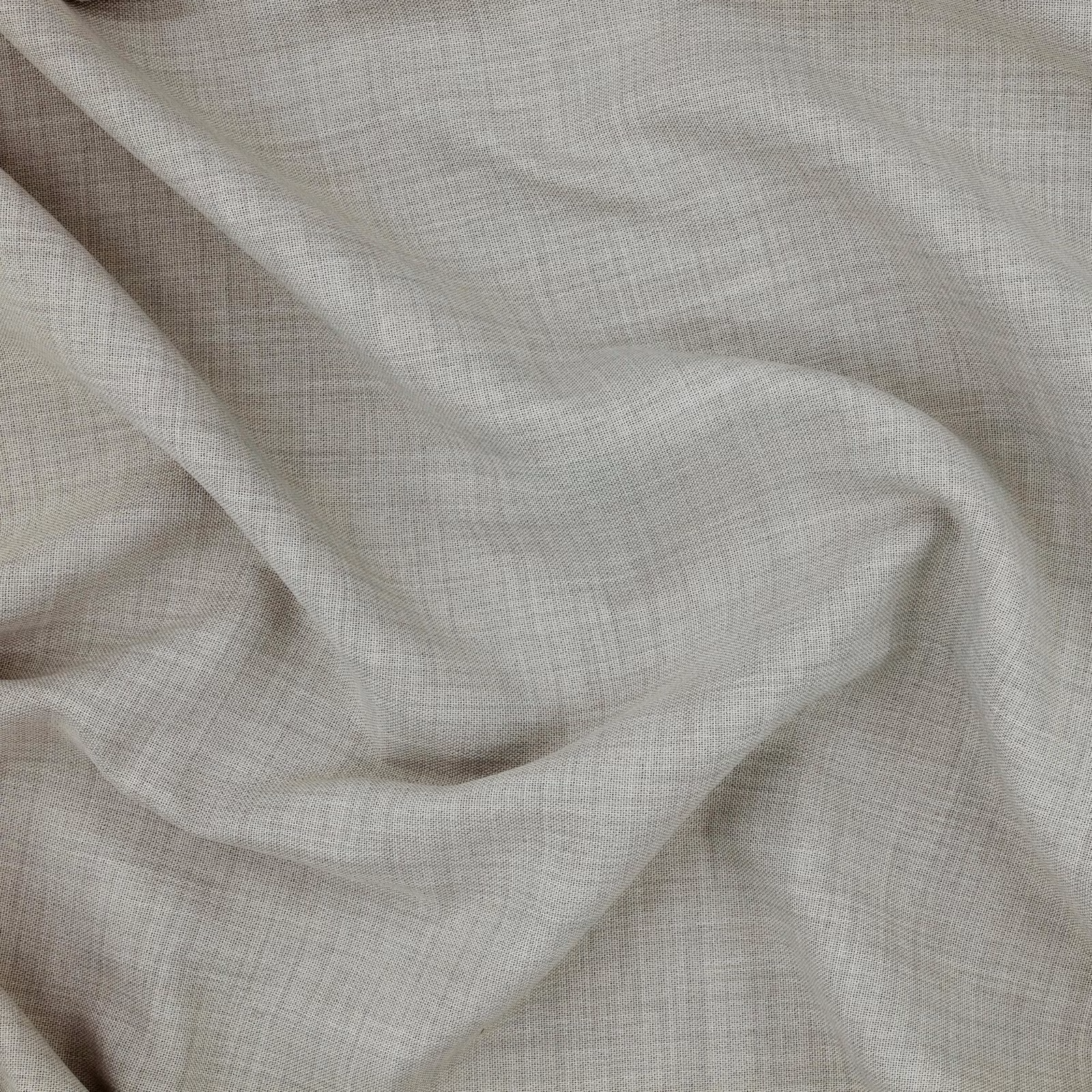 Pale dove-grey woven fabric draped in soft folds with a fine crossweave texture