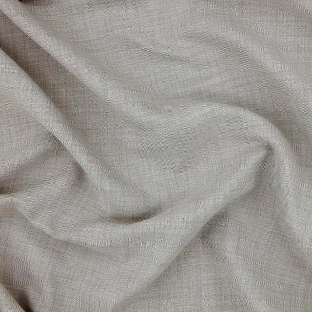 Pale dove-grey woven fabric draped in soft folds with a fine crossweave texture